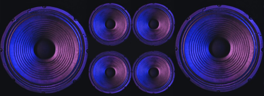 Multiple car speakers with blue and purple lighting