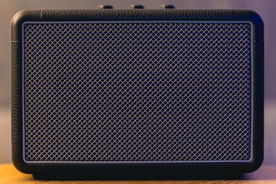 Black speaker cabinet with metal mesh grille